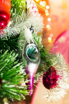 Beautiful bright background with Christmas toy of the spruce needles.