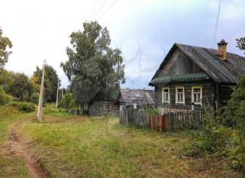 Landscape with an old village house in the village of Palcevo. Tver Region, Russia. Mobile photo.