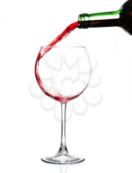 Red wine pouring on white background