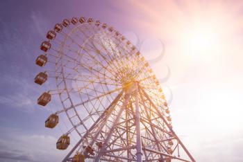 Ferris Wheel Over Blue Sky. Ferris wheel joy sky clouds. Park