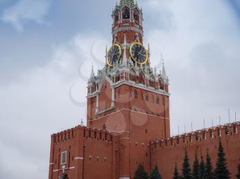 The Kremlin's Spasskaya Tower on a snowy winter day on Red Square in Moscow.