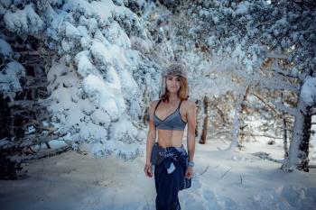 sexy girl in the winter forest in underwear, woman in snow. idea and concept of a strong and seasoned woman, Russian woman