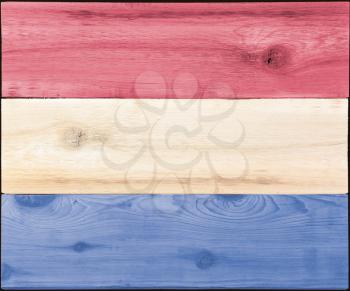 Timber planks of wood that have been painted or stained in the colors of a flag as a background for USA or Luxembourg or Netherlands