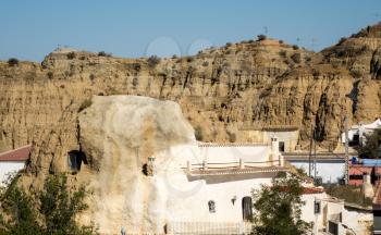 Small cave house built into the hillside of small hill in Purullena near Guadix, Andalucia, Spain