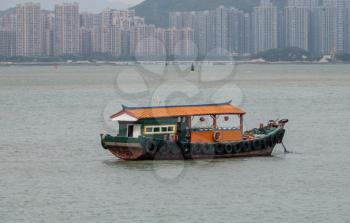 XIAMEN, CHINA - OCTOBER 30, 2018: Fishing house boat anchored off the island of Gulangyu