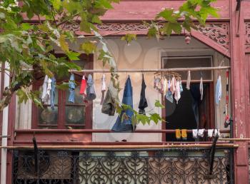 Many traditional chinese apartments have washing hanging outside to dry on balcony or deck