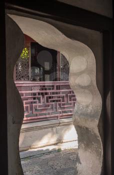 Doorway into small courtyard with balcony in Yu or Yuyuan Garden in  the old city of Shanghai