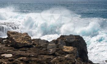 Large waves crash on the shoreline of Ka'ena Point on the extreme west coast of Oahu in Hawaii