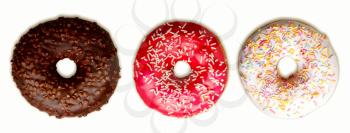 small set of three bright freshly baked donuts with icing isolated on white background