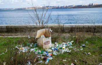 Nikolaev, Ukraine - 06 april 2021: Garbage in the park. Garbage, empty wrappers, packaging left by people after relaxing in the park in nature