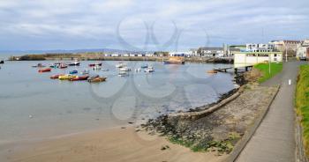 Small harbour with boats in the Portrush city, Northern Ireland.
