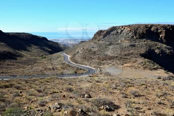 View of  Gran Canaria mountains valley with curvy road.