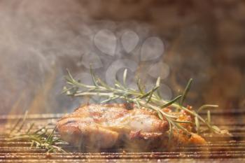 Grilled Deboned Chicken Meat On Smoking Barbecue With Rosemary