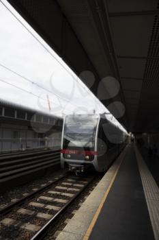 Subway Station Outdoors With Train Approaching Its Stop