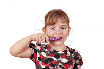 little girl brush their teeth