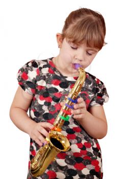 little girl playing music on saxophone