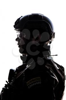 Silhouette of young soldier in military helmet on white background