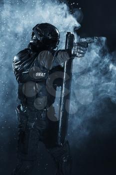 Spec ops police officer SWAT with ballistic shield