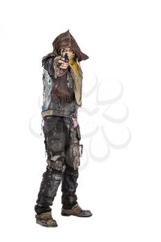Nuclear post apocalypse life after doomsday concept. Grimy survivor with homemade weapons pointing a gun at the camera. Studio closeup portrait on white background