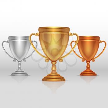 Gold, silver and bronze winners cup, goblet vector. Set of sports trophies to the winners illustration