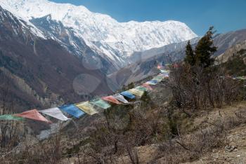 Buddhist praying flags in nepal high mountains