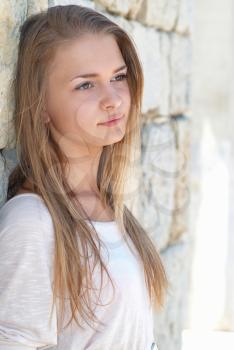 Beautiful blond girl outdoors against the sea 