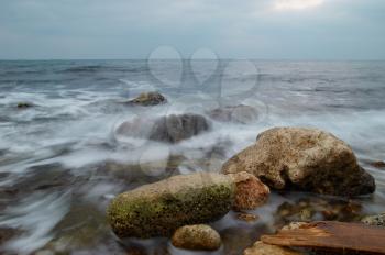 Storm, rock near the shore.
