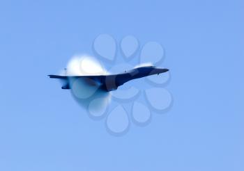 The fighter overcomes the sound barrier, the moment of transition of the sound barrier by plane.