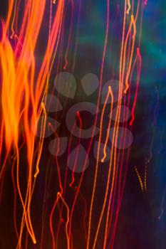 Colorful lights blurred in motion as abstract background.