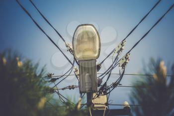 Street lamp in the day over blue sky background