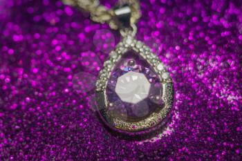 Fashion silver pendant with purple zirconia, amethyst imitation.