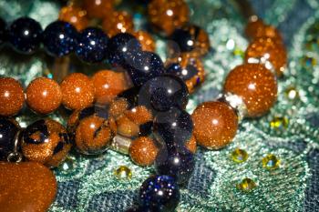 Boho beaded bracelets with brown and dark blue glitter glass stones.