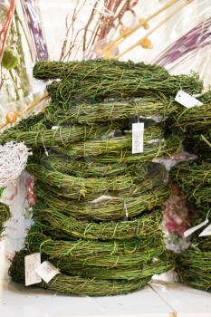 Green wreaths made of small branches in the view