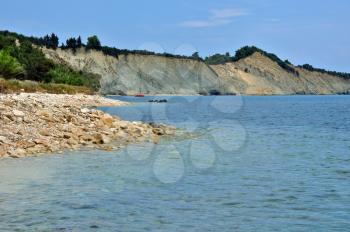 Stone beach seaside and eroded coastal ridges at the island of Zakynthos, Greece.