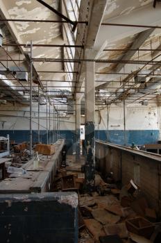 Ruins of an abandoned factory. Industrial interior abstract architecture.