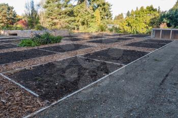 A view of unplanted garden plots in Seatac, Washington.