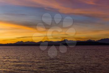 A silhouette shot of a sunset over the Olympic Mountains in Washington State.