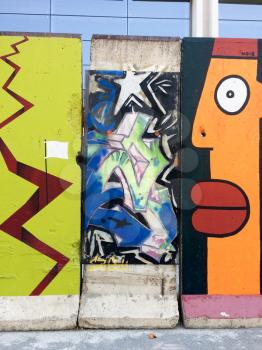 Urban street art on Berlin Wall section in california street