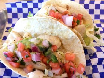 Fresh Fish tacos on blue white checkerboard paper