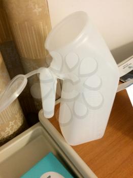 urine bottle urinal in hospital room made of plastic