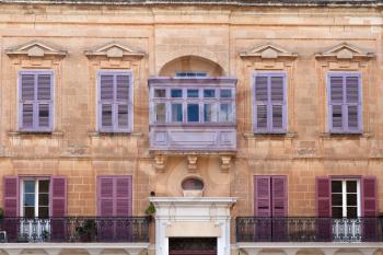Mdina, Malta - 4 January 2020: Typical Maltese blinds and balcony