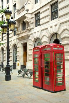 Two red booths in the street in London UK