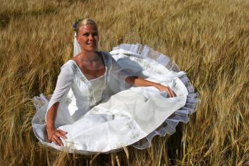 Royalty Free Photo of a Bride in a Field