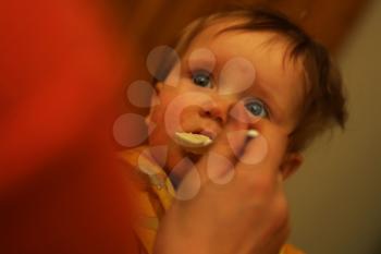Royalty Free Photo of an Infant Being Fed