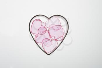 Opaque hearts in a heart cookie cutter.