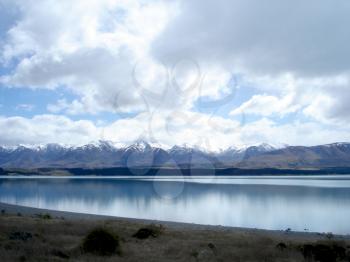 Royalty Free Photo of Water, Clouds, Mountains and Foothills
