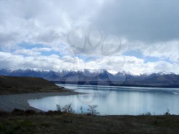 Royalty Free Photo of Mountains, Clouds and a Shoreline