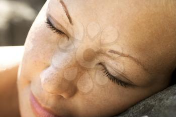 Royalty Free Photo of a Close-up of a Woman's Face With Closed Eyes