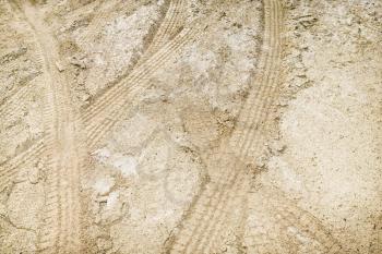 Royalty Free Photo of Tire Tread Marks in Dirt