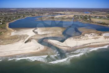 Aerial view of Bridgehampton, New York with shoal and inlet.